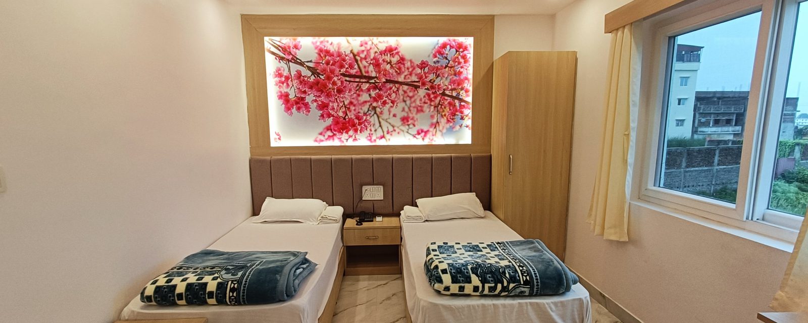Twin room blossom wall art at Hotel Niko International